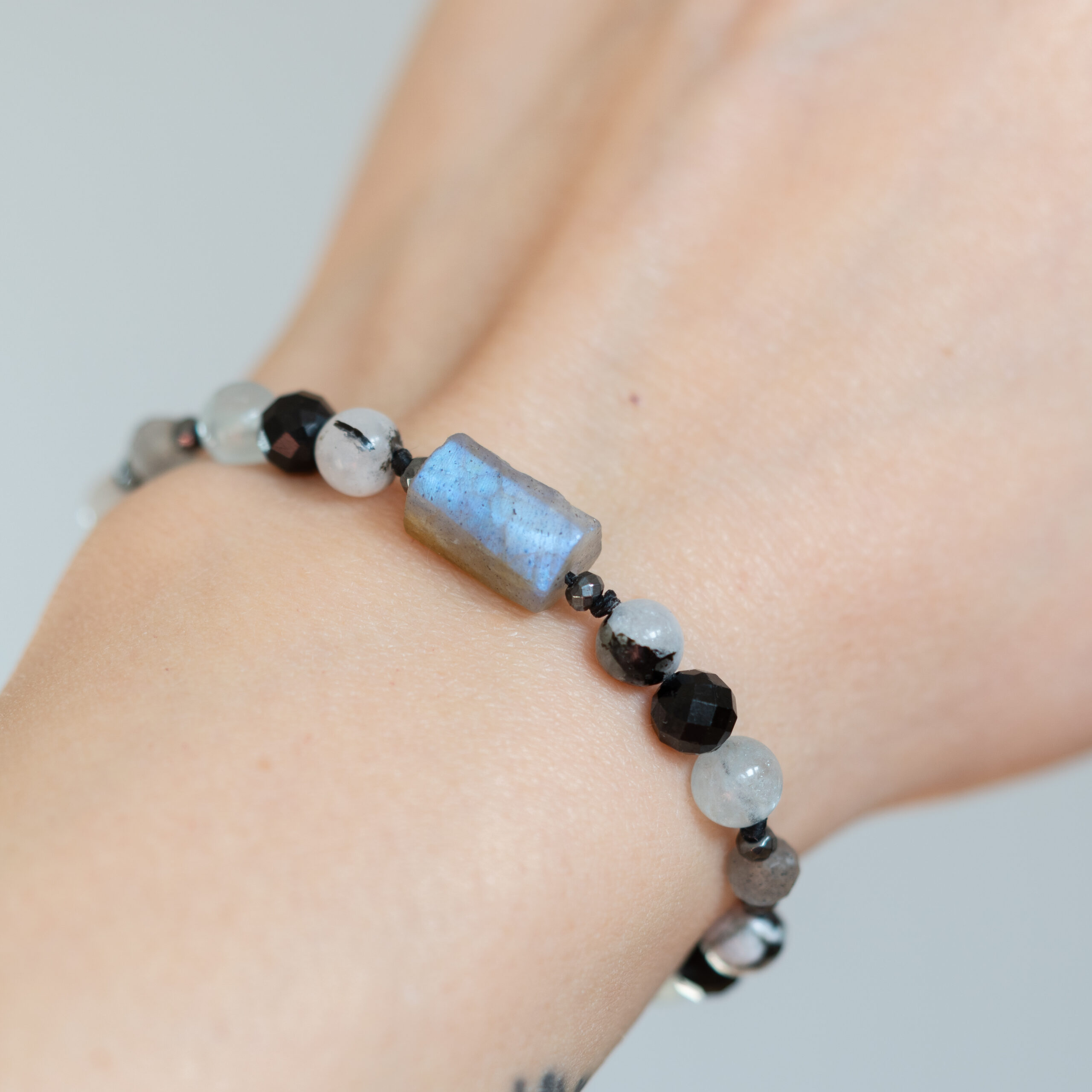 bracelet with labradorite and tourmaline on the wrist